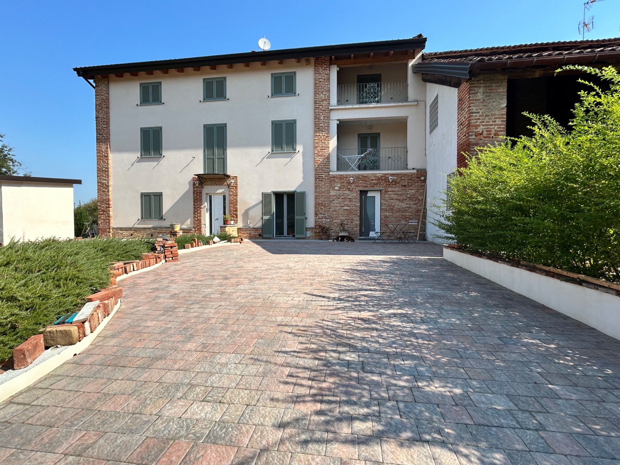 A real Piedmont country house with traditional shutters in summer